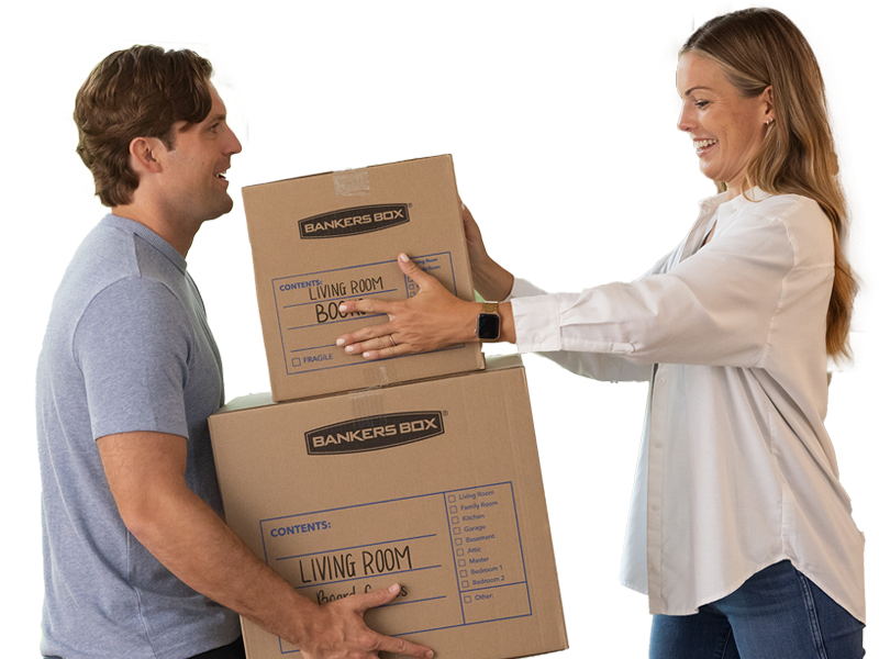 man and woman carrying moving boxes